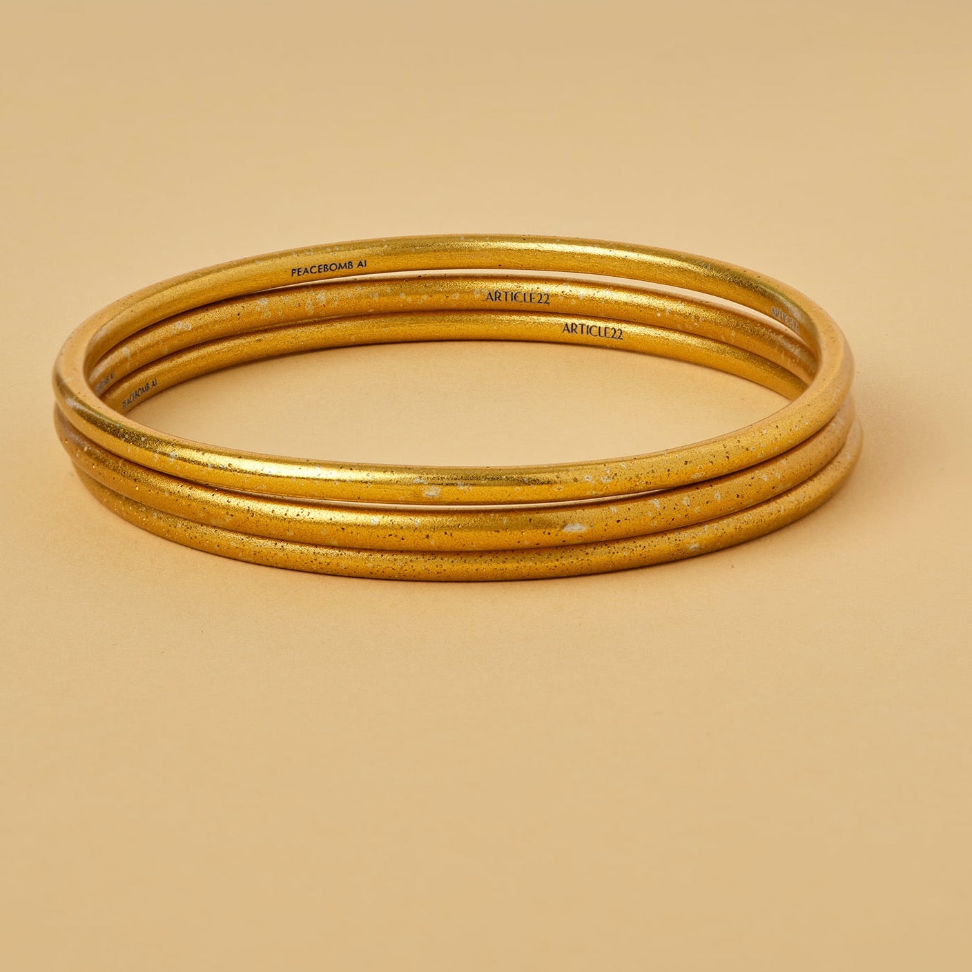 VIRTUOUS CIRCLE GOLD TONE SKINNY BANGLE