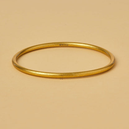 VIRTUOUS CIRCLE GOLD TONE SKINNY BANGLE
